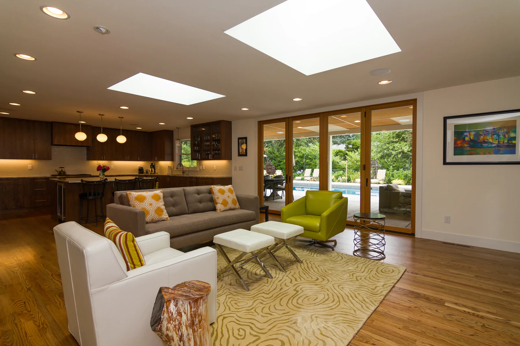 Open floor plan living space. La Cantina Doors allow seamless interior/exterior transition. Two skylights open up the space vertically and provide lots of natural light, even on overcast days.