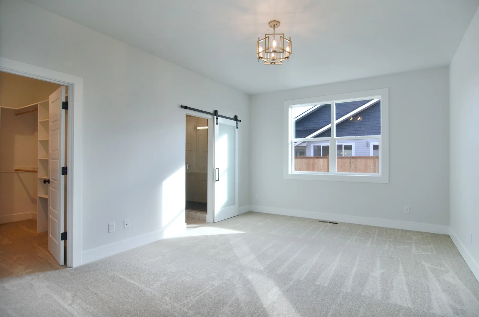 Master suite with walk in closet and master bathroom