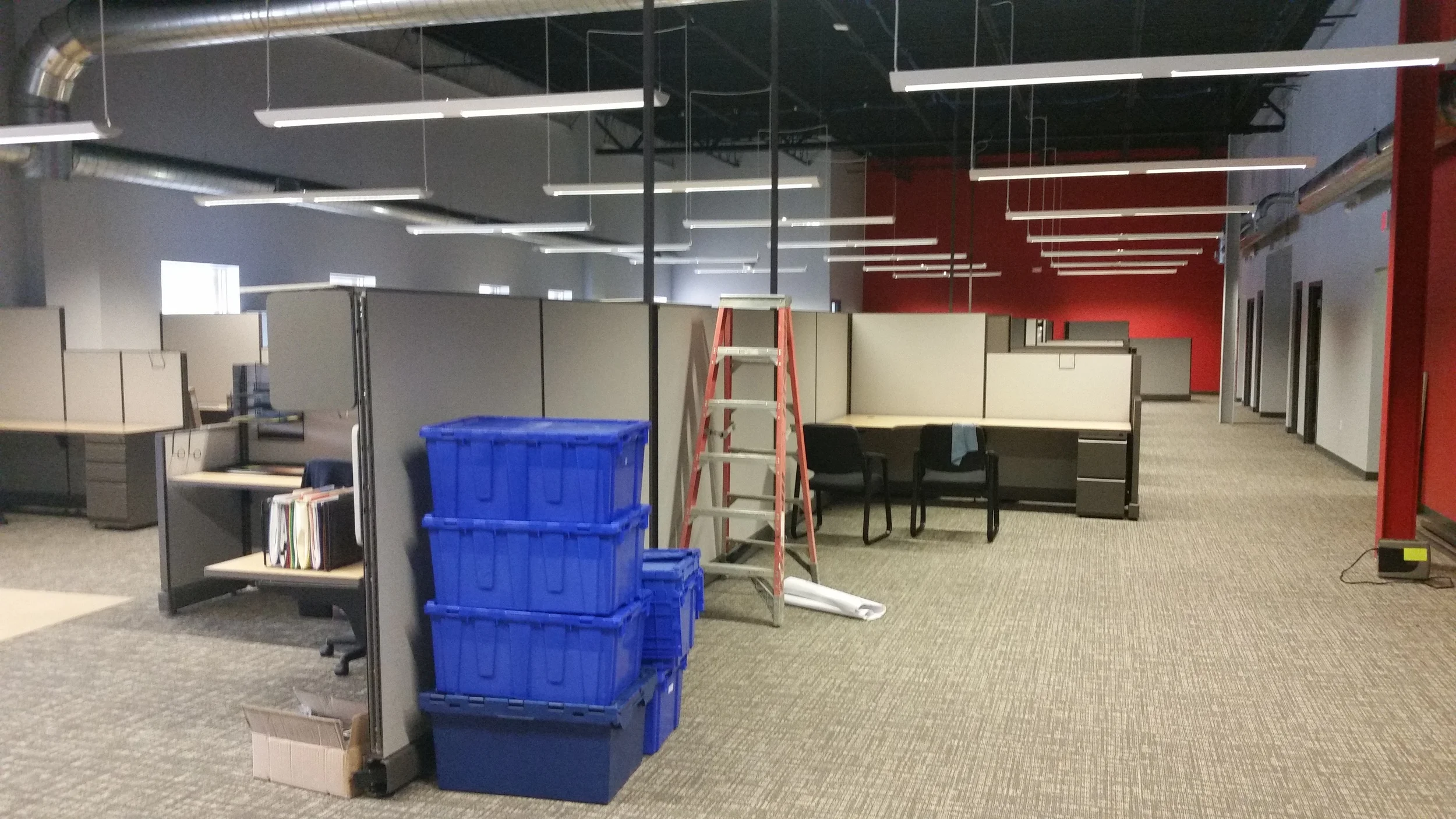 Employees have started to move in and get comfortable in their cubicles.