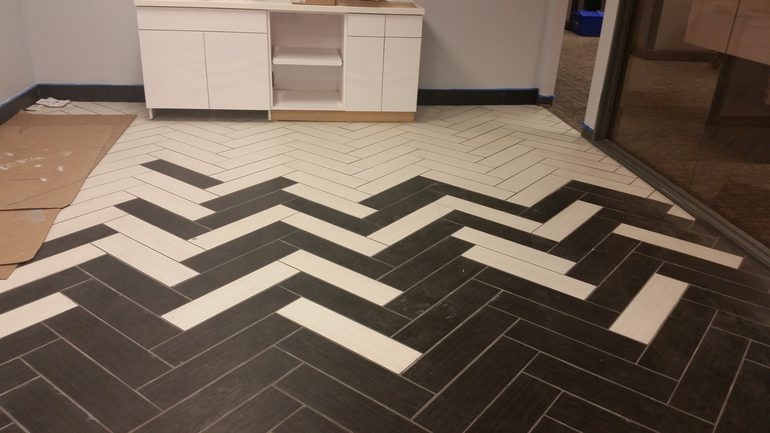 DalTile wood grain tile installed in a herringbone pattern. 