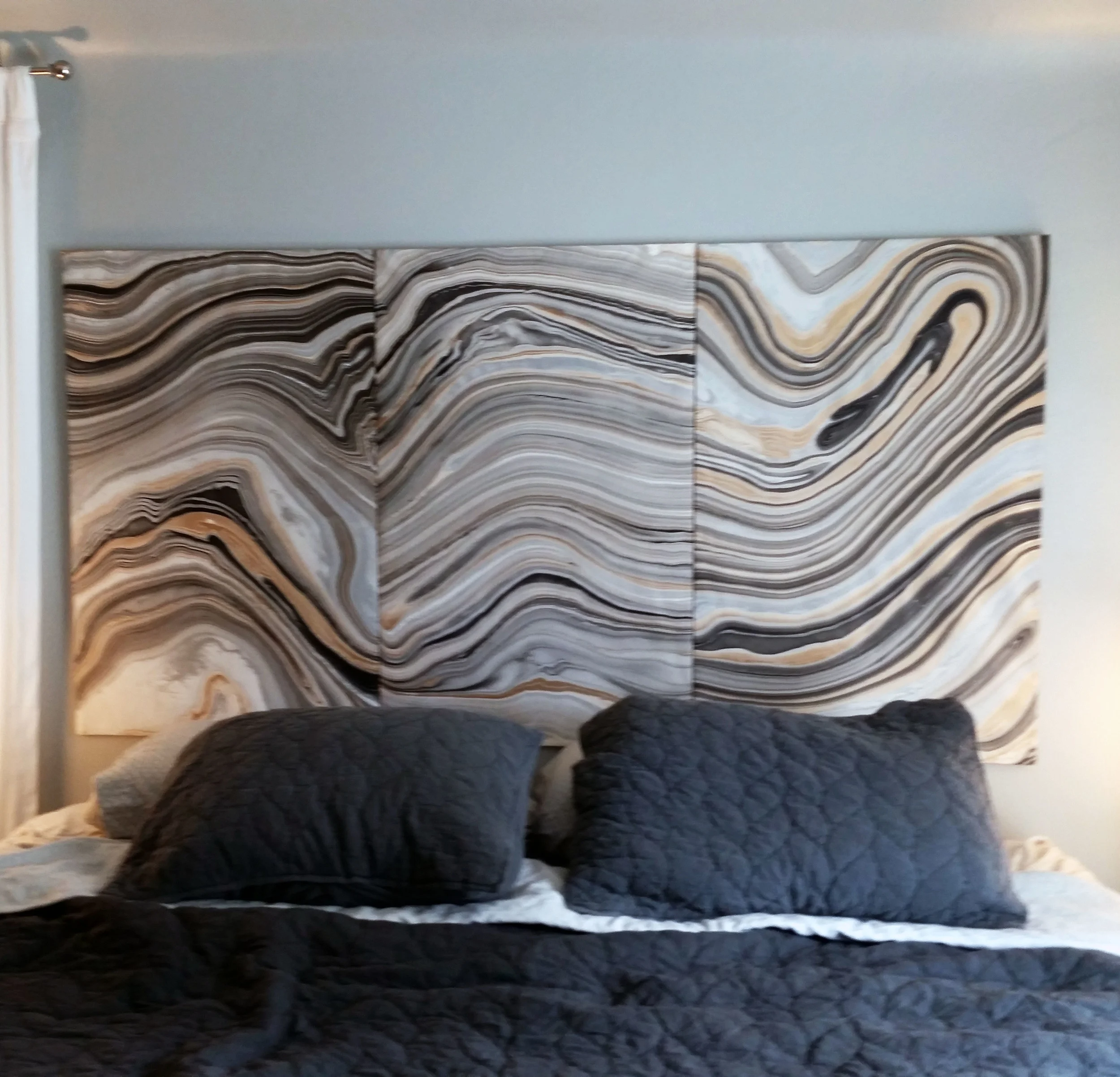 This is the marbled headboard from the previous post. I decoupaged 3 wood panels and hung them as a triptych behind the bed. I really love how it turned out. The movement of the marbling creates great contrast between the mostly monochromatic elements in the bedroom. I am definitely going to style the bed with more throw pillows and a throw blanket to give it more layering. Perhaps touches of gold... 
