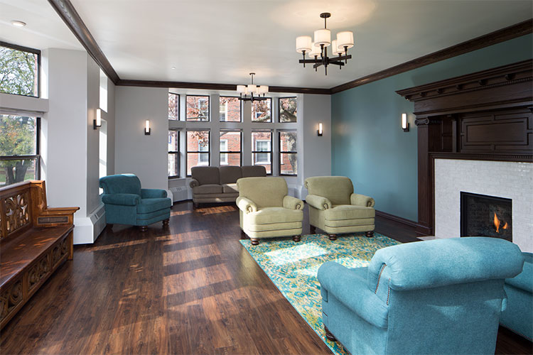 JZID selected flooring, wall color, lighting, fireplace tiling, and millwork design for the lounge.