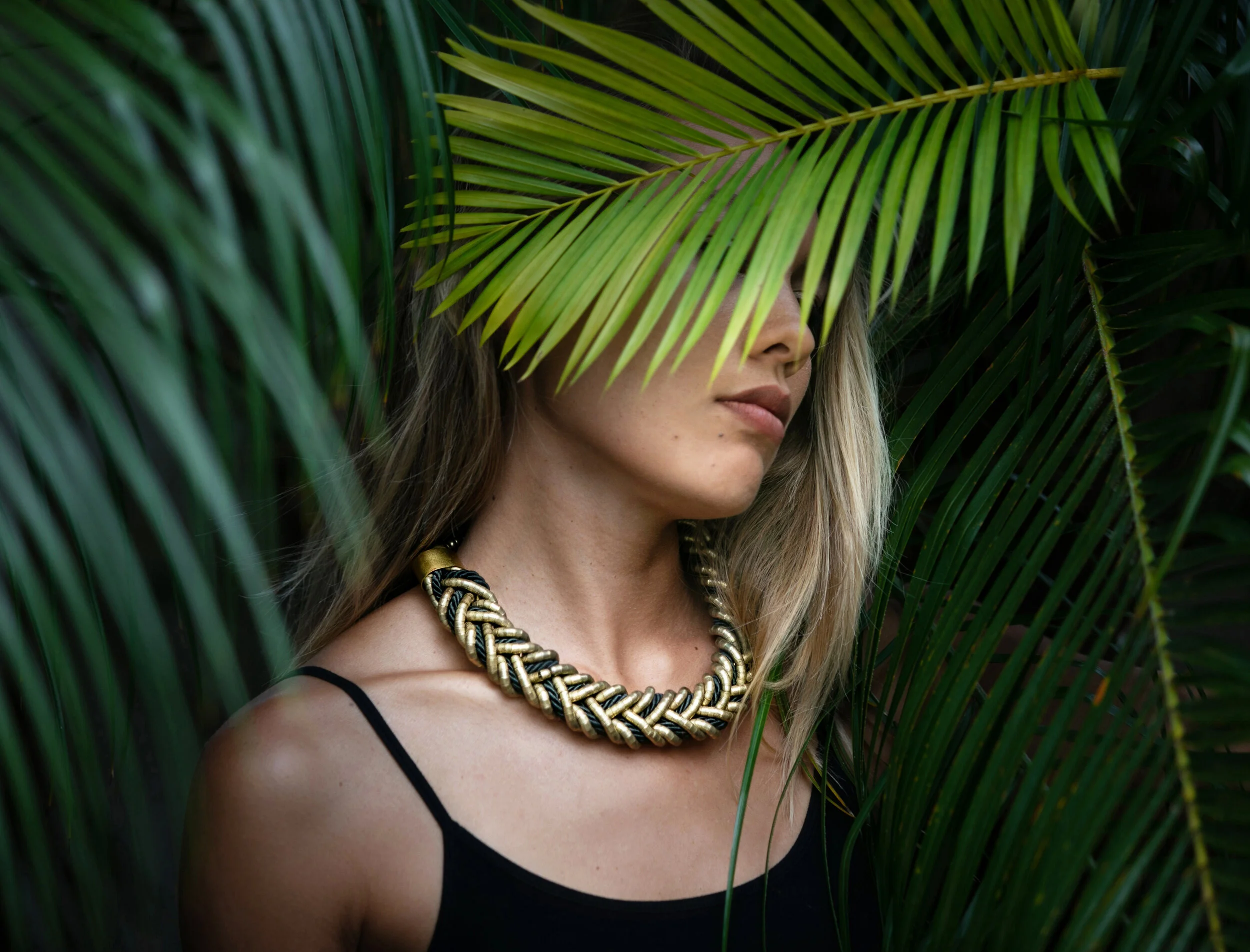 Asia Brynne wearing a handcrafted necklace from The Skipping Stone