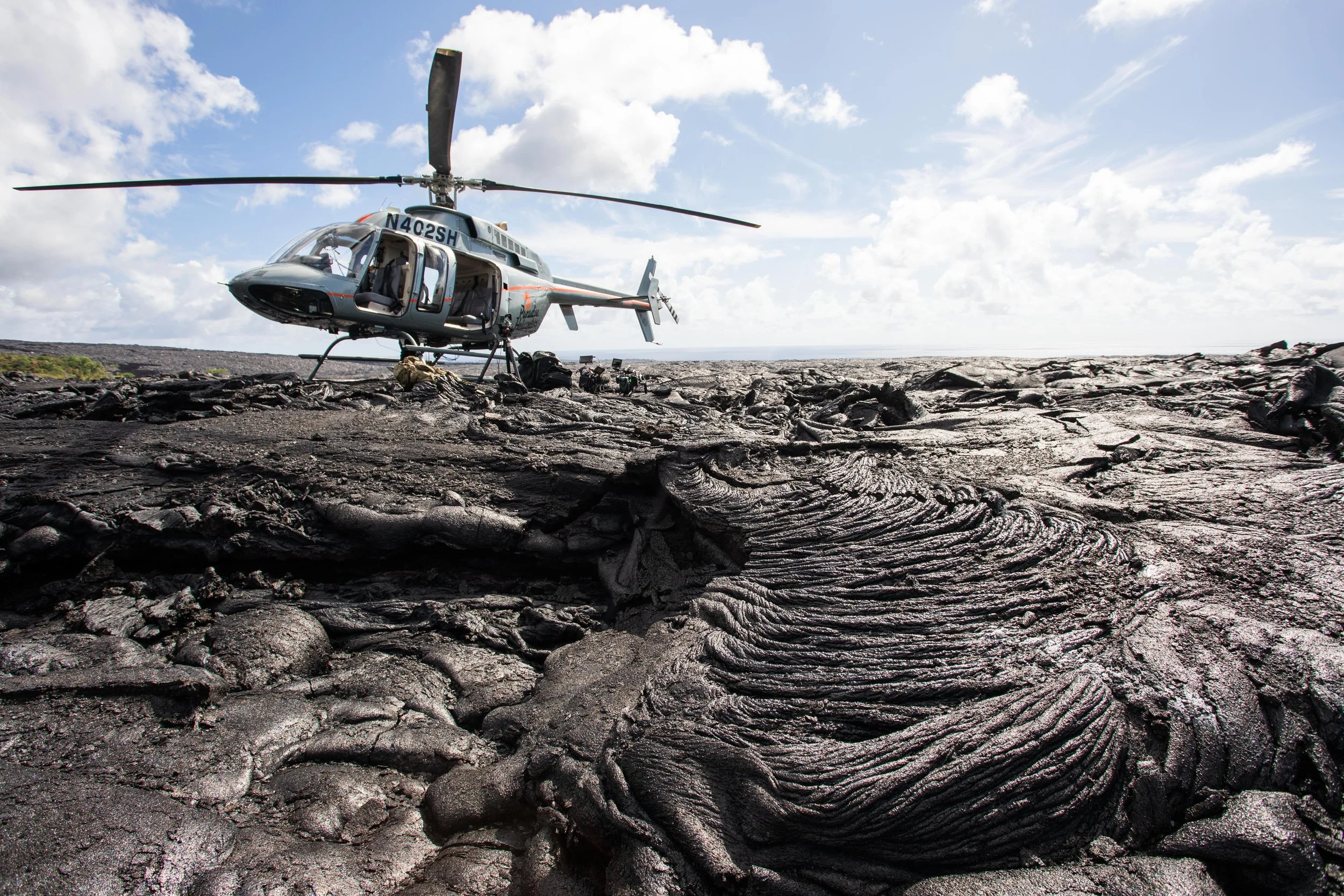 Paradise Helicopters landing on lava rock