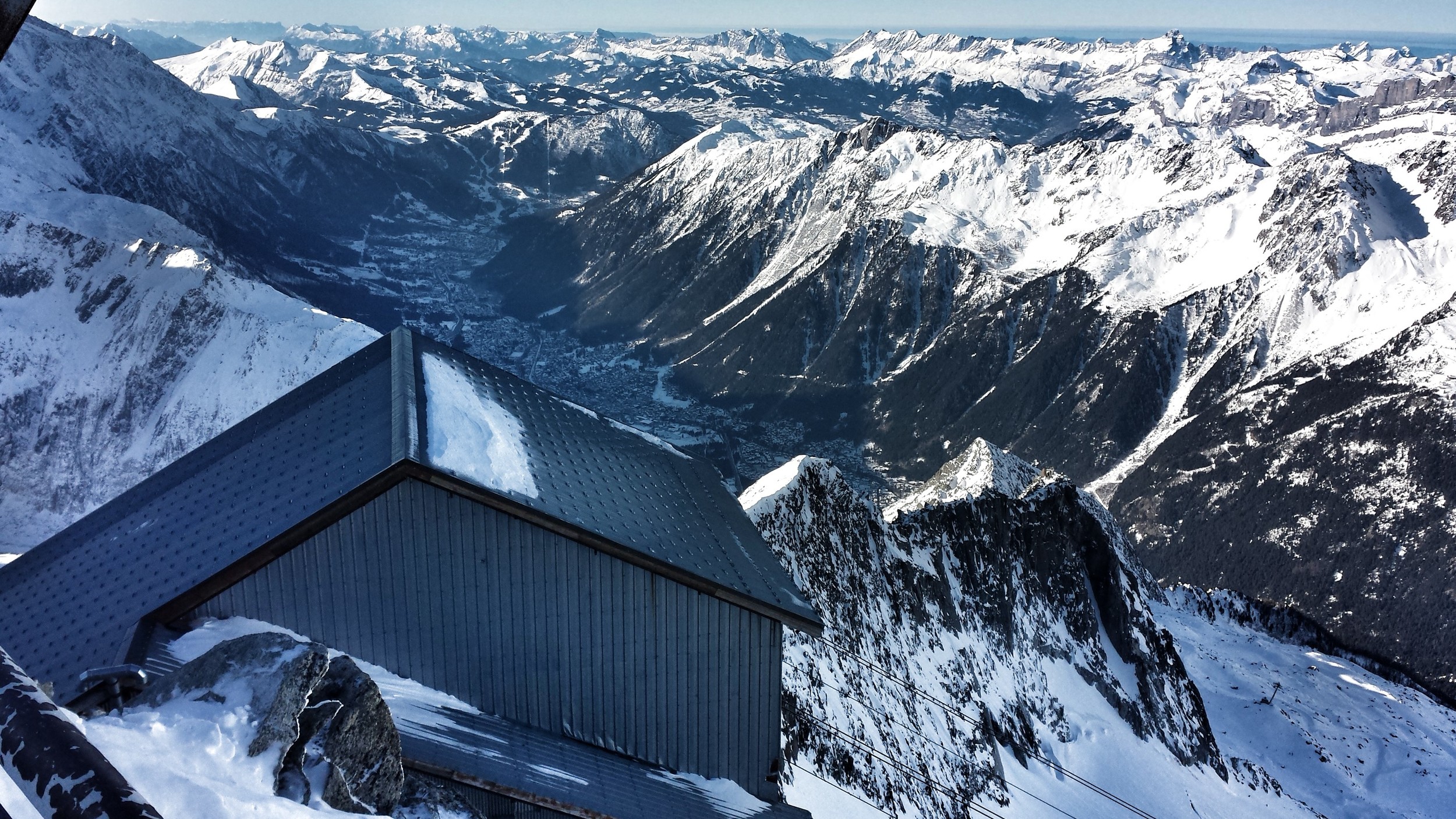 View down the Chamonix valley. The little house in the lower left is the cable car house and is actually huge, but everything looks small against these mountains.