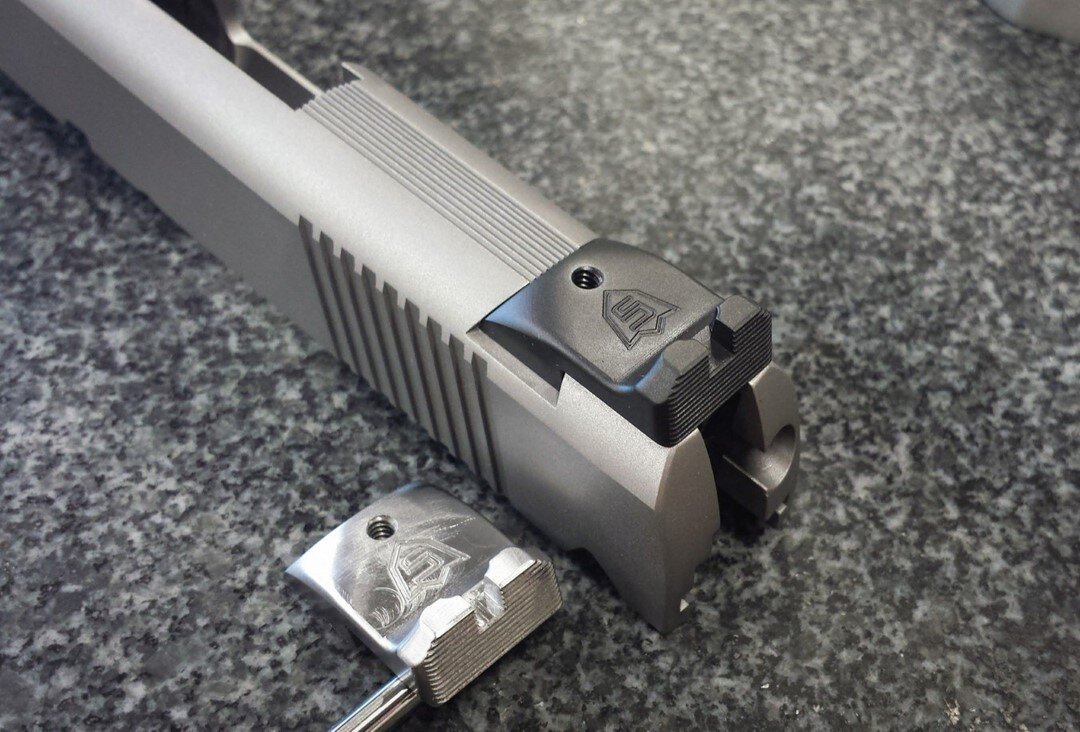 The Chen Full Custom Rear Sight installed on a slide we had in the shop, next to one of our rear sights' mid-production. As you can see, the rear sight is manufactured to be as close to a custom sight as possible, meaning they are completely dehorned