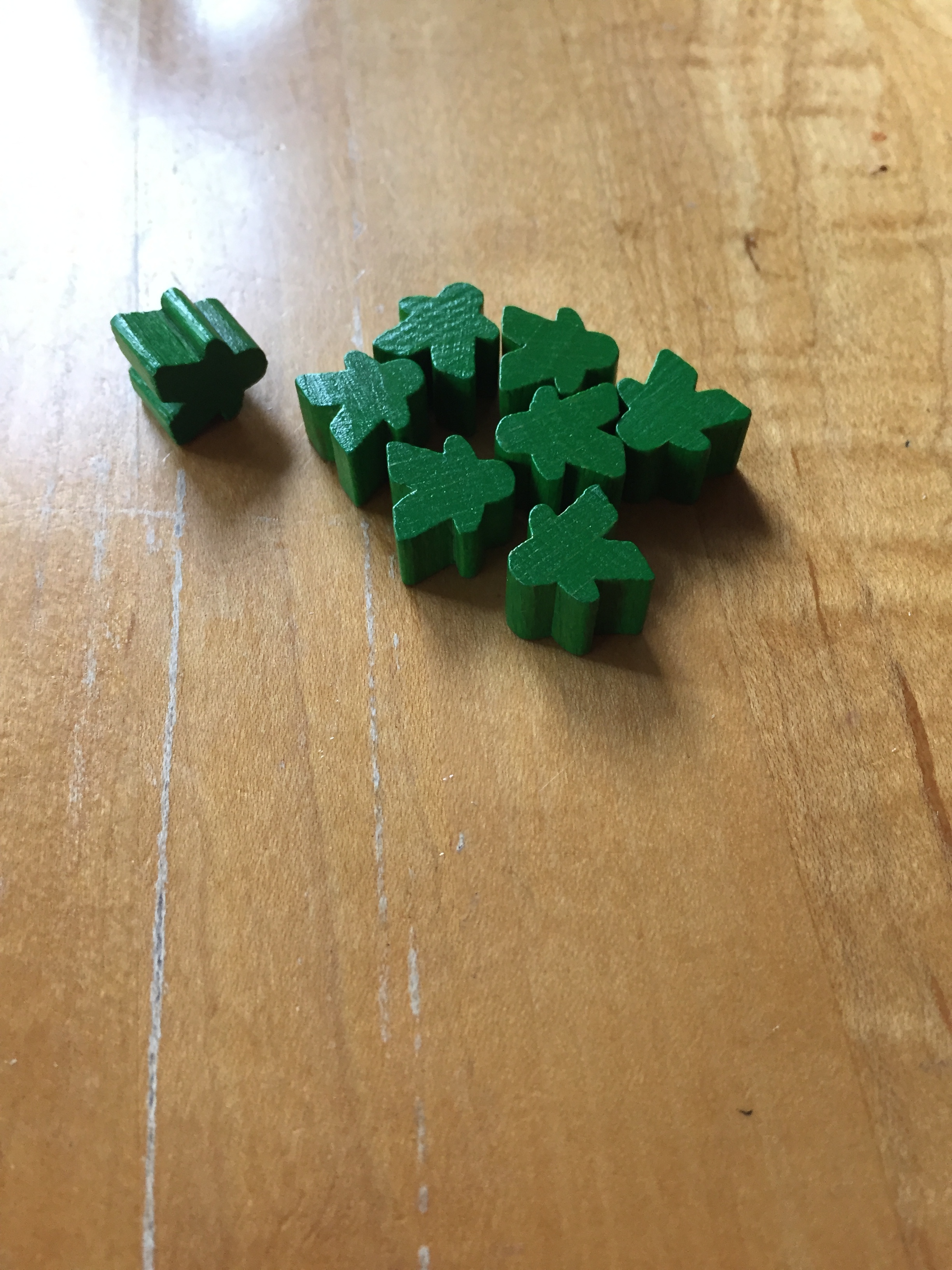 These are "meeple" - you use them to play Carcasonne. Specifically, these were my green meeple.
