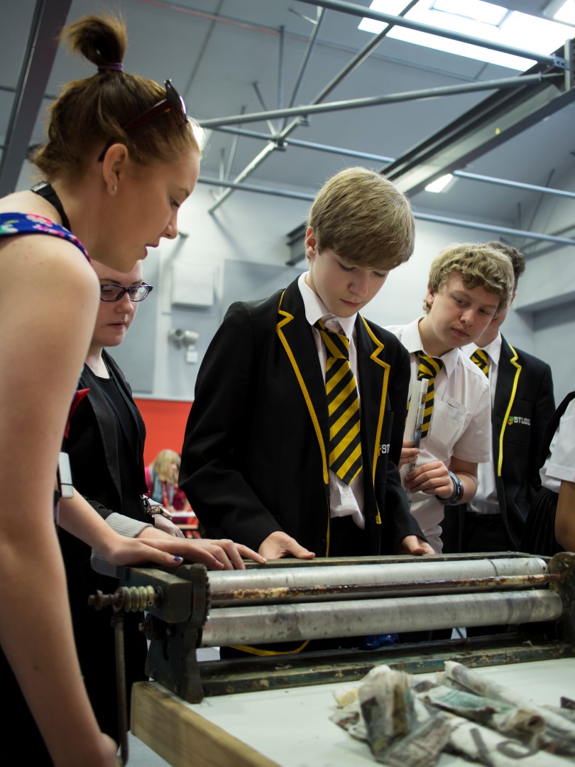 Students from The Studio School in Liverpool working out how to use the STIXX rolling machine before a load of local primary school children descend on their STEAM CO. Day