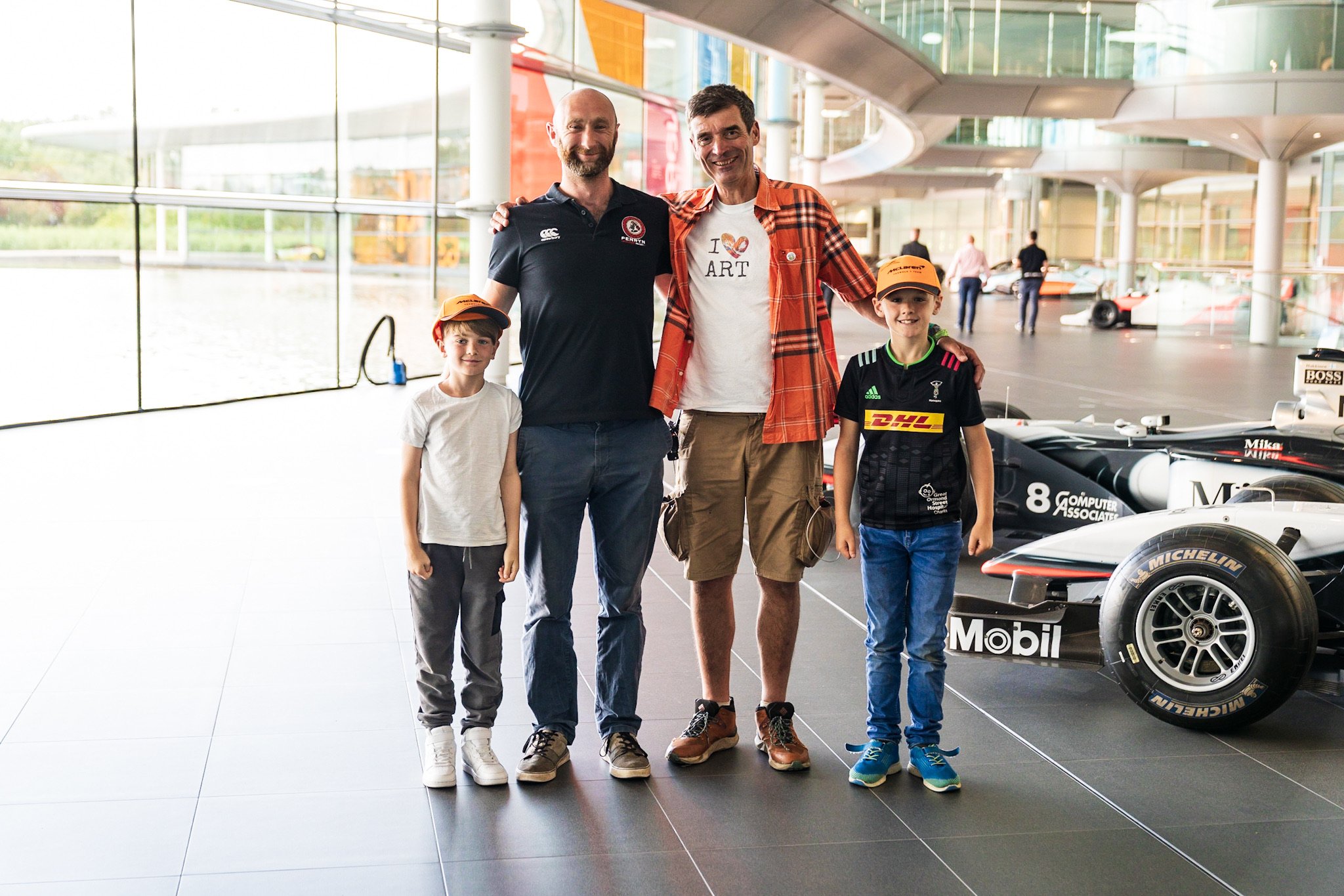 Cornwall family Dion Mellows with son Oscar and  nephew Stanley Pearce at McLaren Technical Centre.jpg