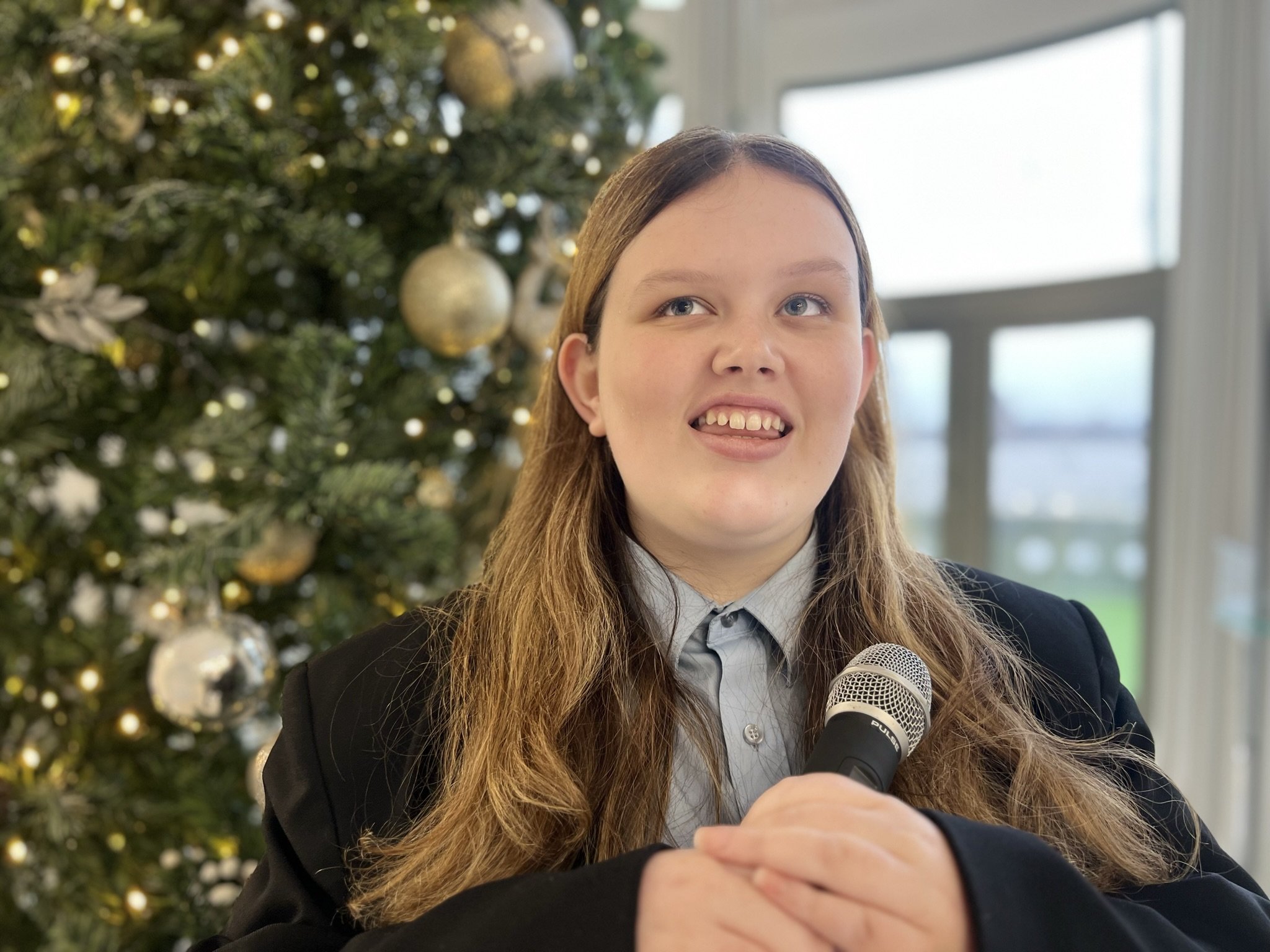 Emily in front of Christmas Tree