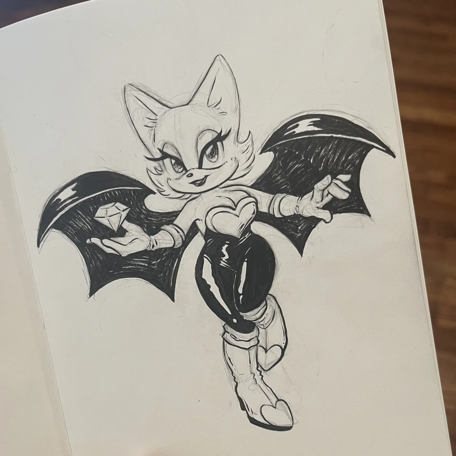 ink sketch of Rouge the Bat holding a chaos emerald