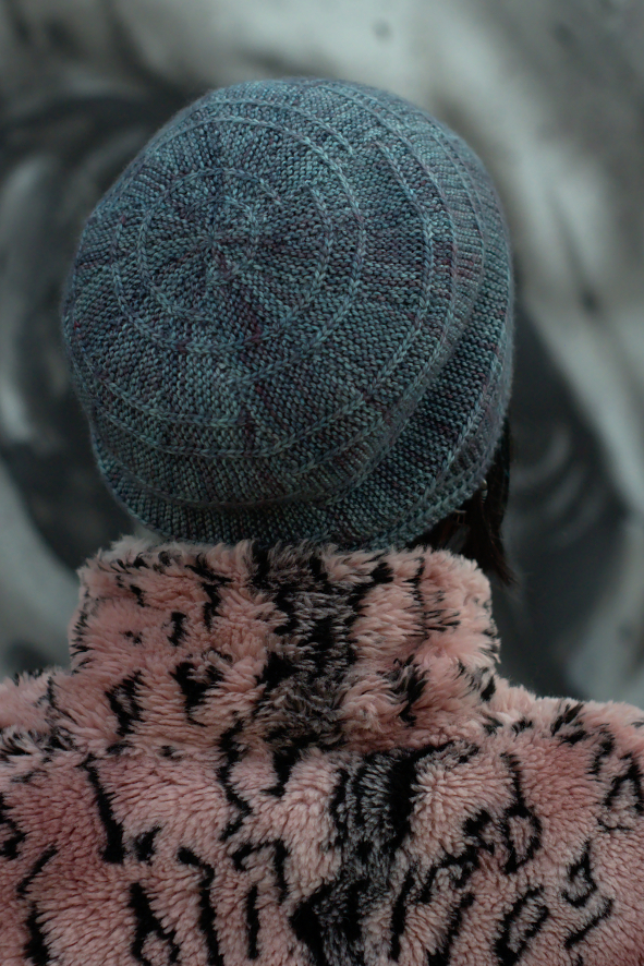 Circled 1, featuring offset arcs. Slouchy Hat pattern ideal for variegated sock yarn