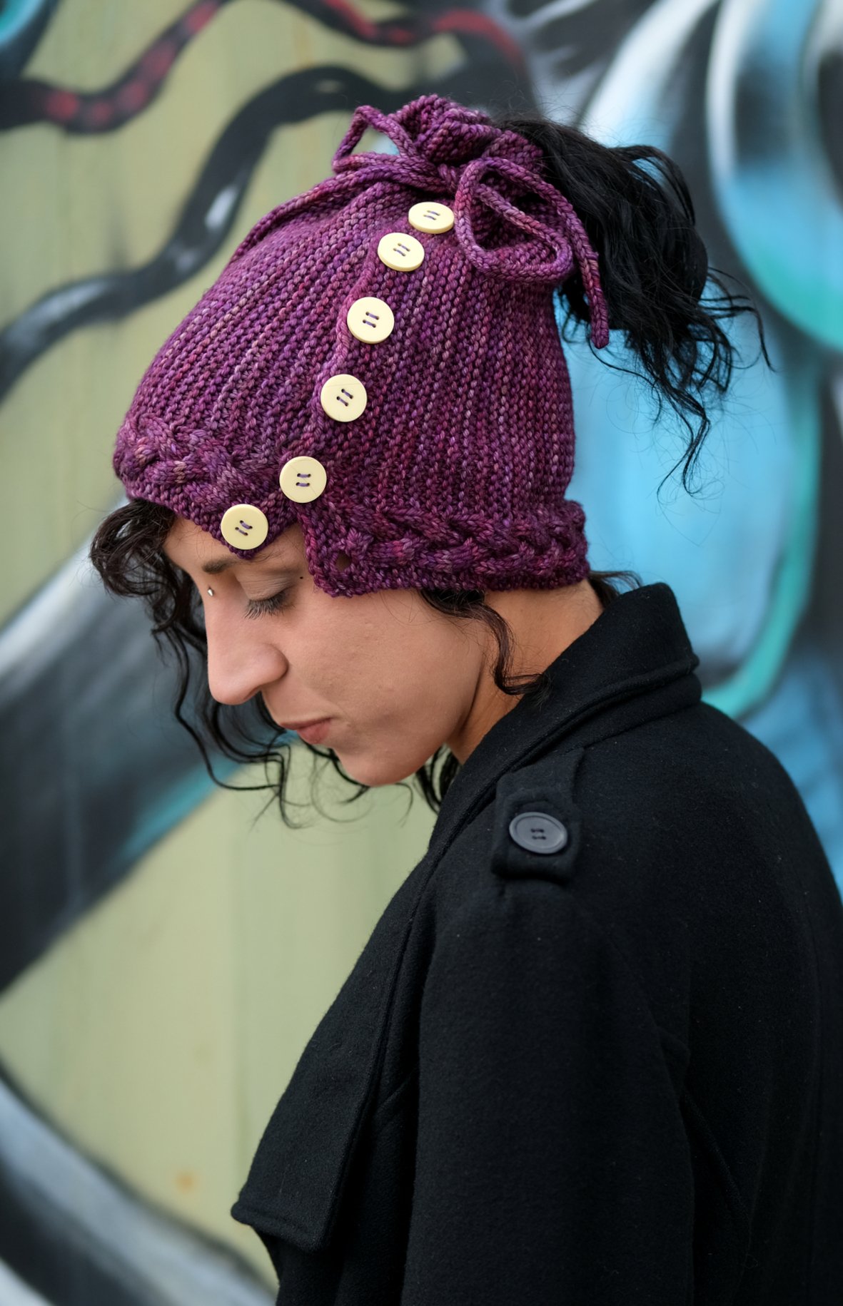 Arcus sideways cabled ponytail messy bun Hat knitting pattern