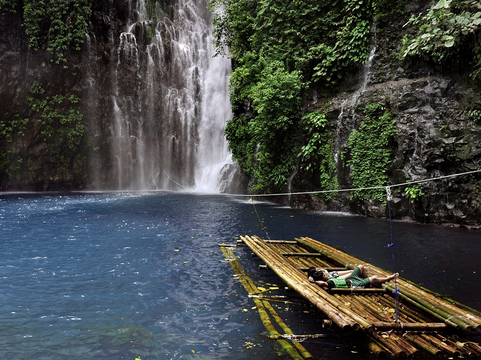 Peacefully Napping on a bamboo raft