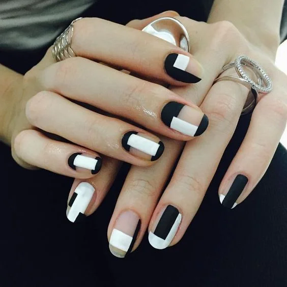 09-matte-black-and-white-negative-space-geometric-nails.jpg