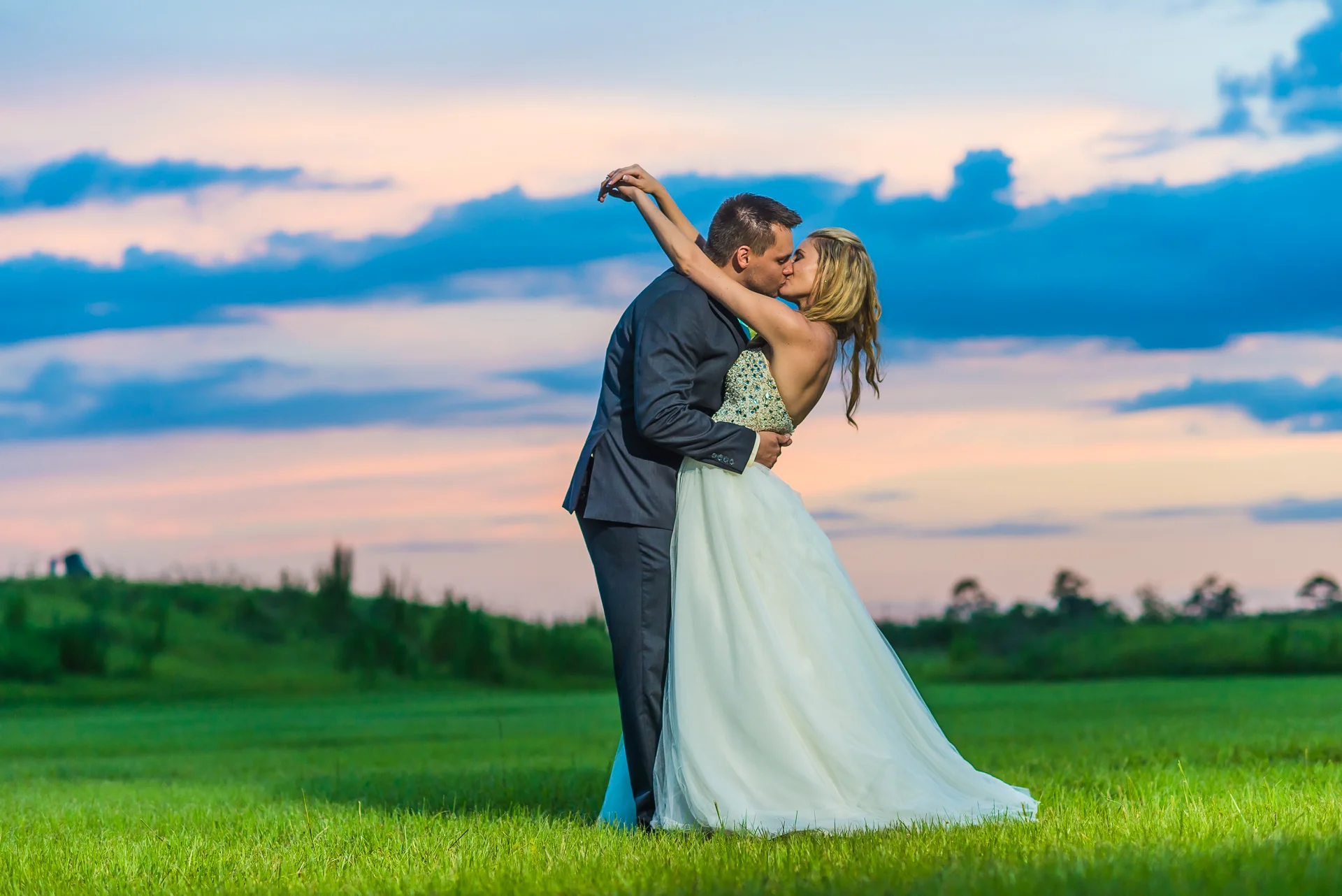Molly and her husband at sunset on their wedding day