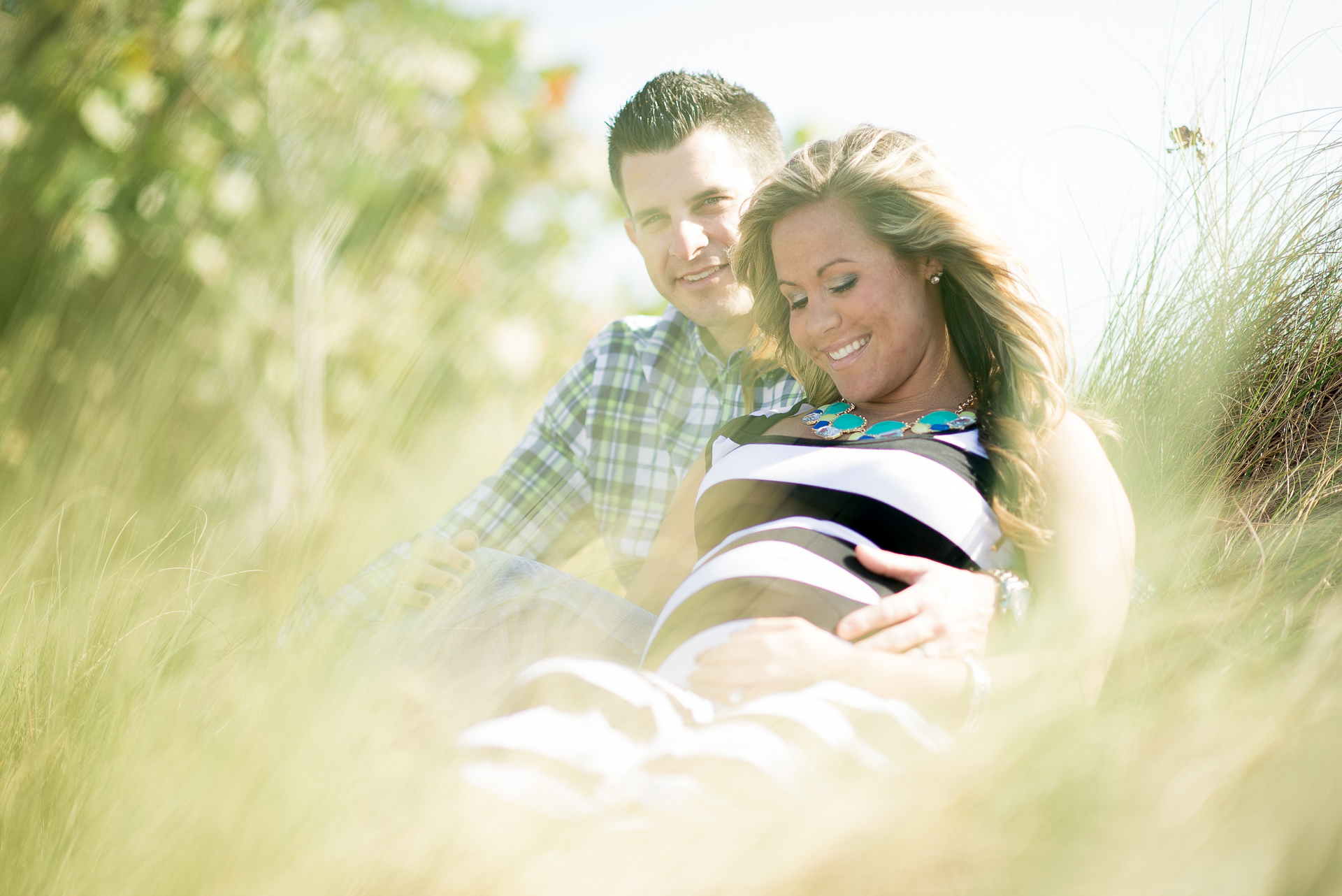 Nicole and her husband Marshal during their maternity photo shoot at blowing rocks