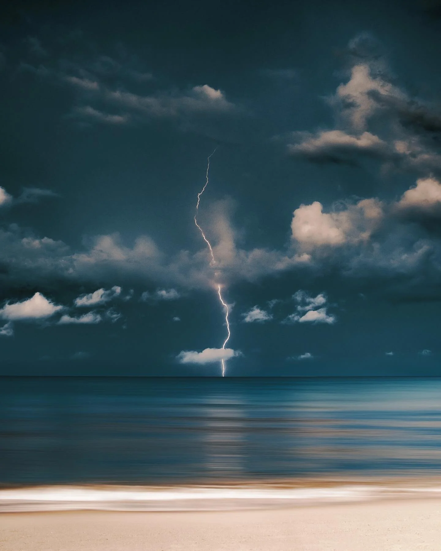 Love watching lighting strike out in the distance. It&rsquo;s so calm on the beach but I know how hectic it probably is out there