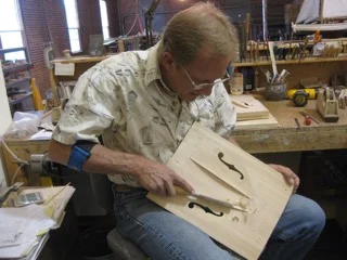 Bruce carving a top at his Logan,MT shop