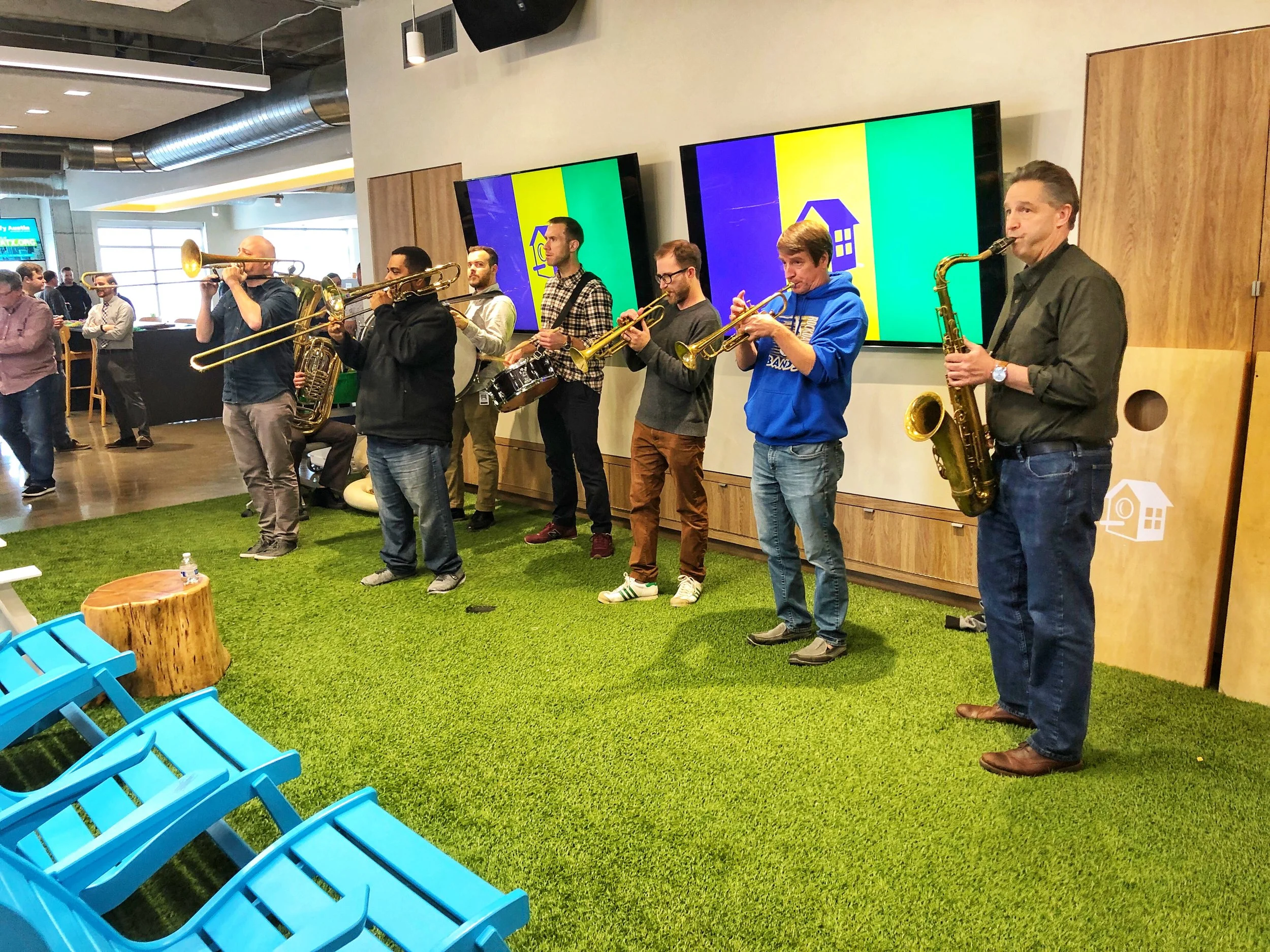 The Urban Achievers Brass Band celebrating Mardi Gras with Team HomeAway in our Austin office.