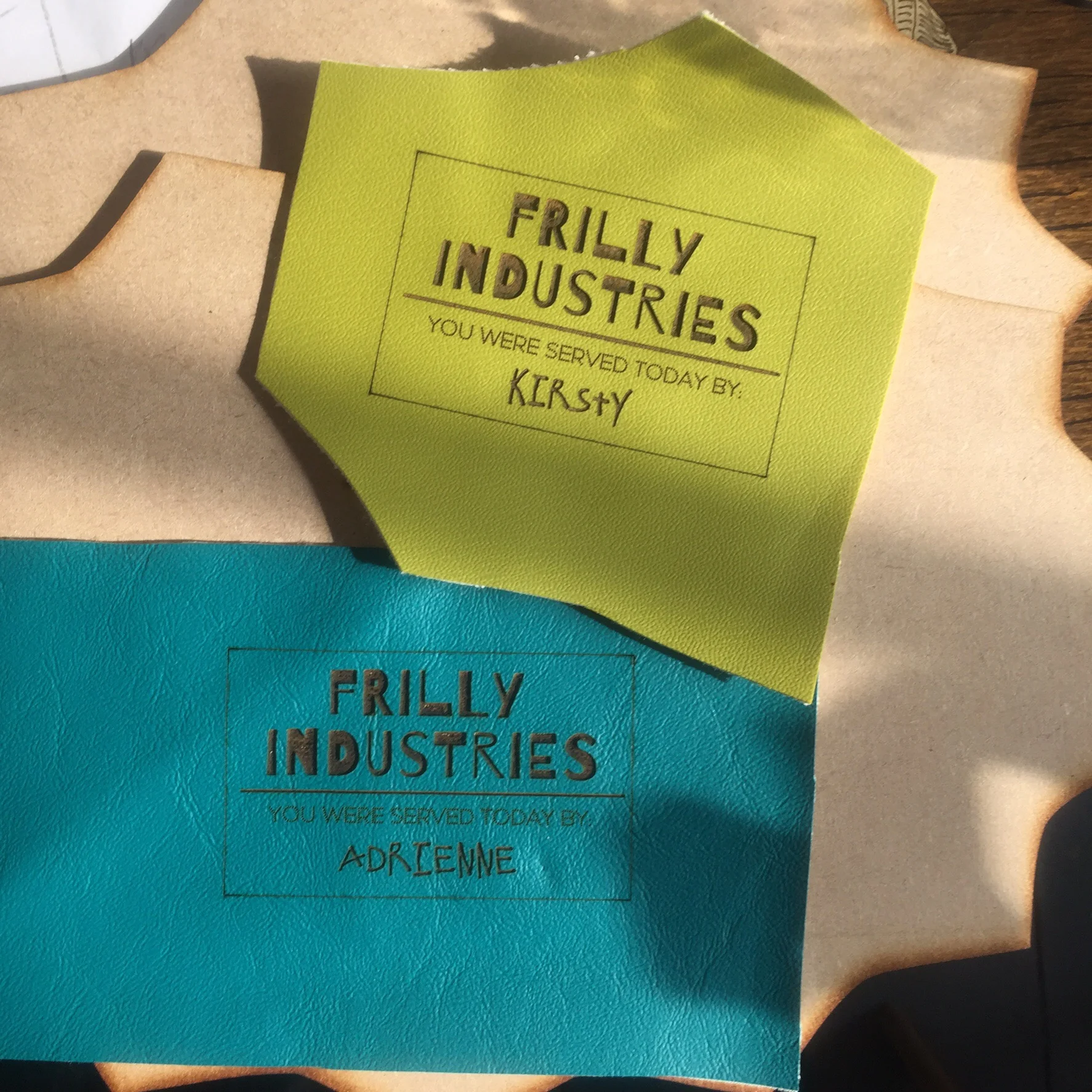 Apron name tags for our stall uniforms, etched by Bertha
