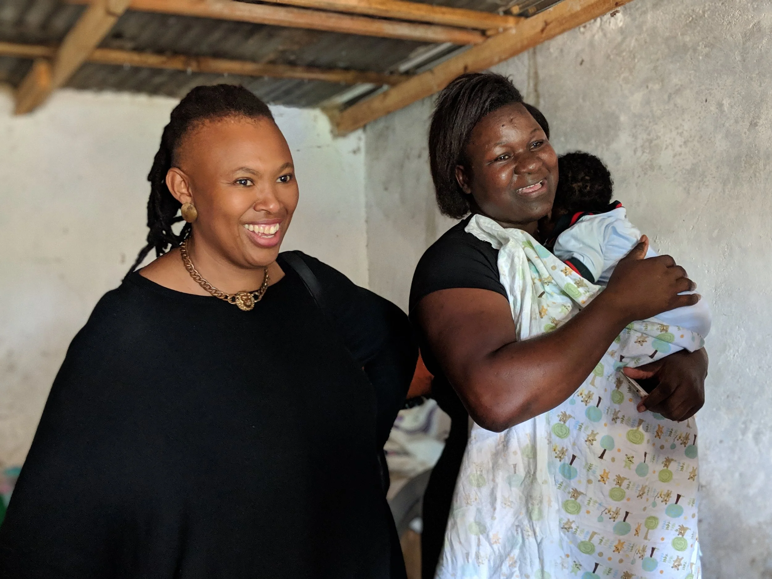 Flame Tree Initiative Fellow, Dineo Mkwezalamba (left) and social entrepreneur, Trinitas Mhango and her baby (right).
