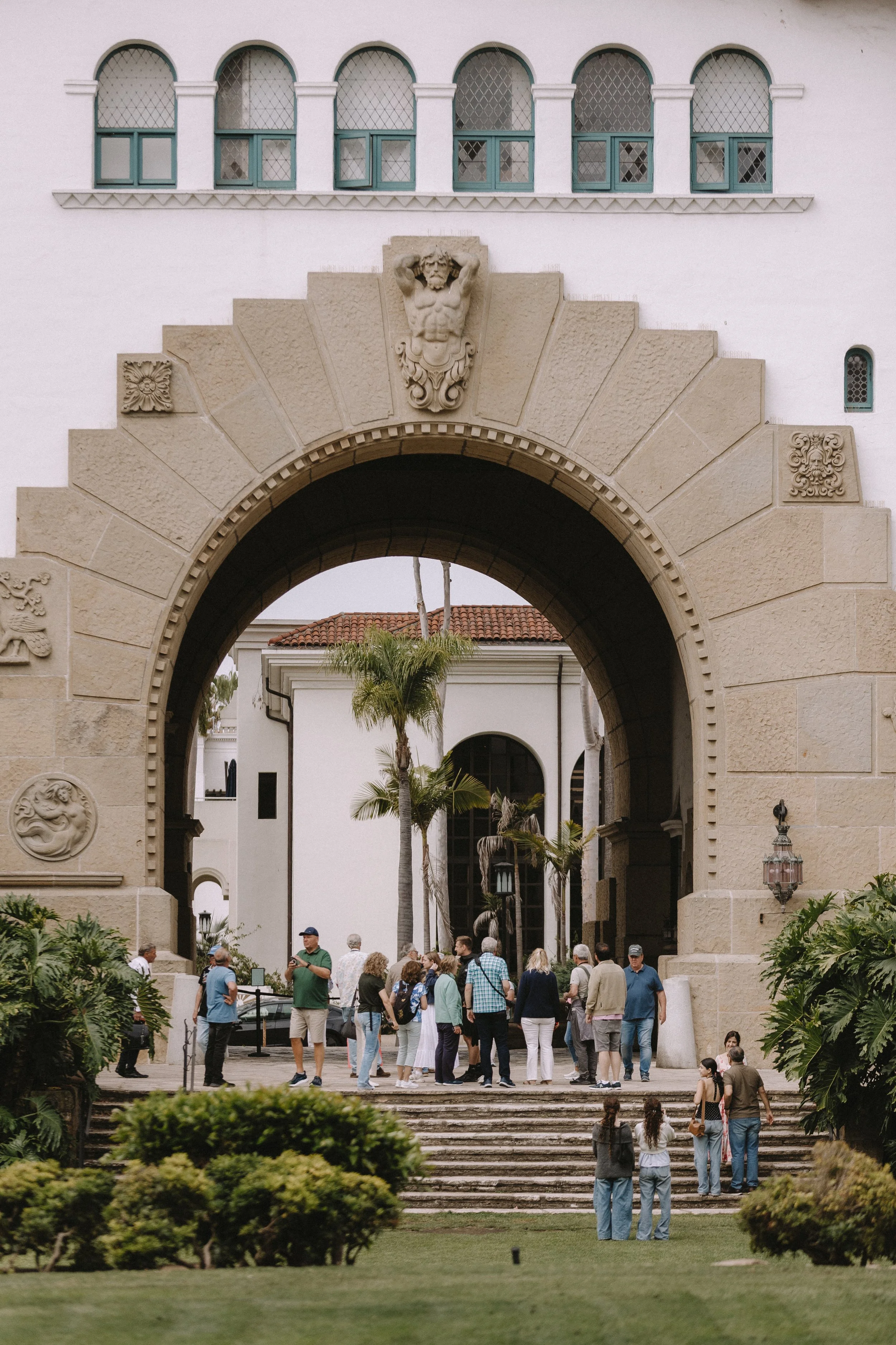 Docents lead a group of tourists around the Santa Barbara Courthouse