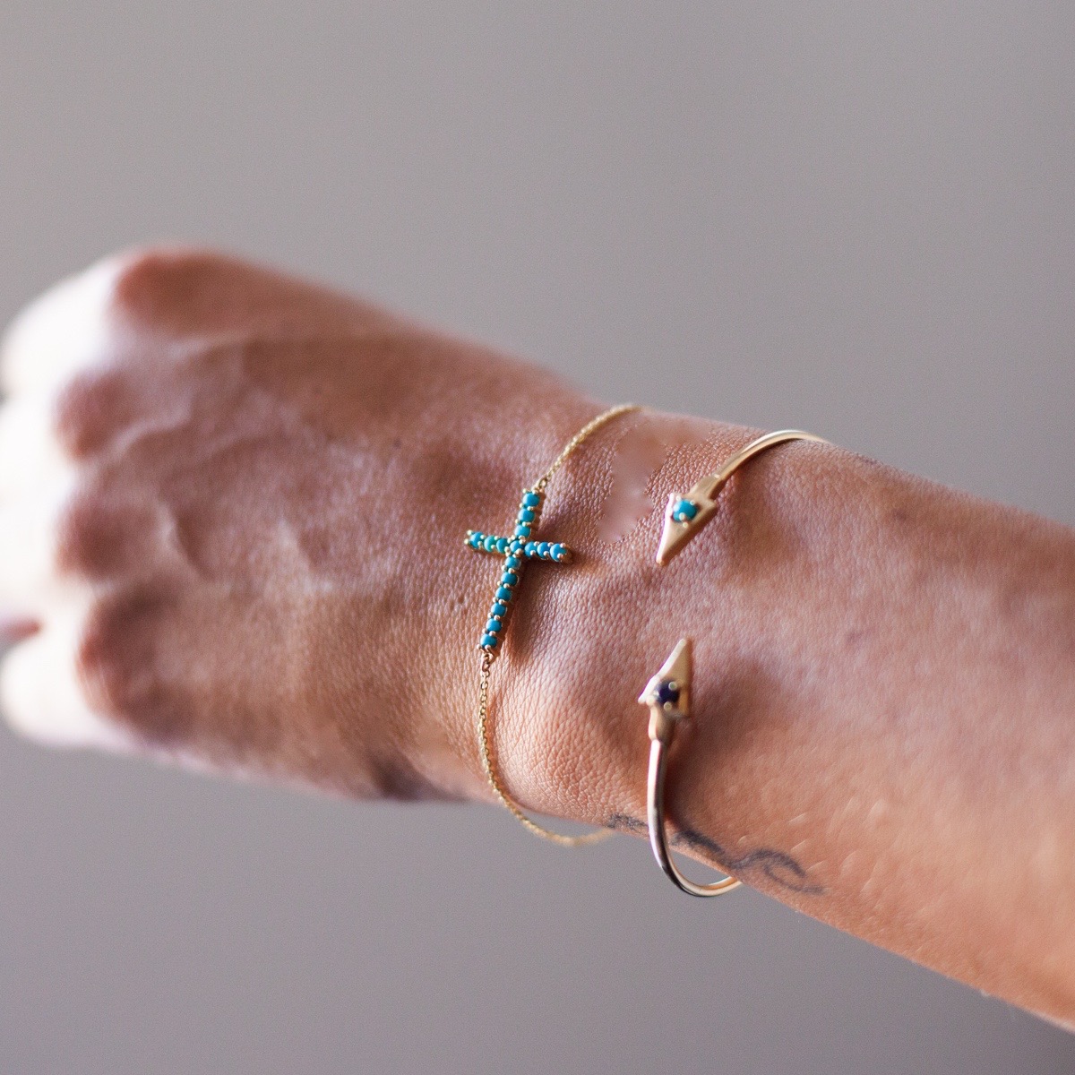cross bracelet and arrowhead.jpg