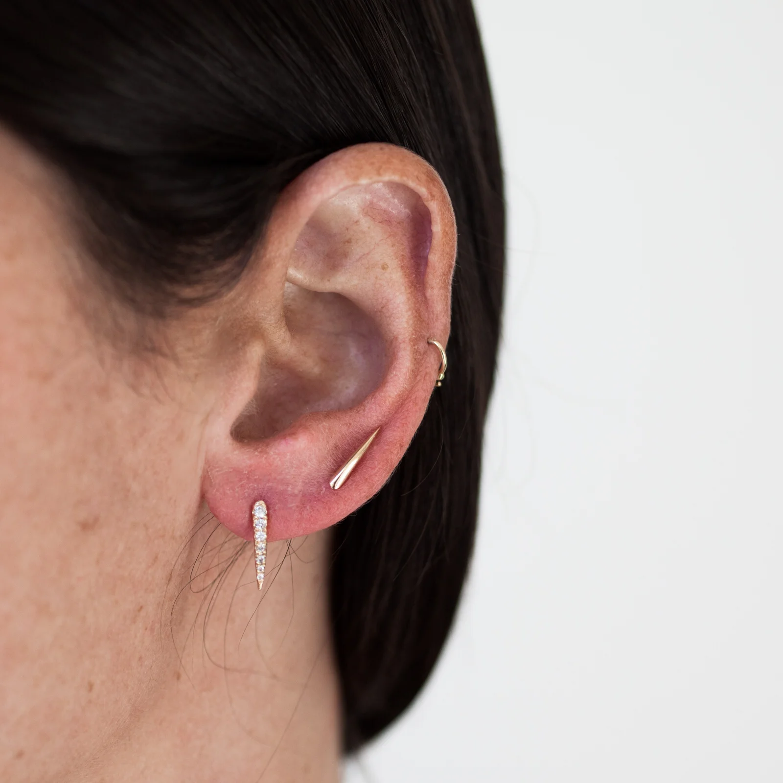 White claw stud and gold claw.jpeg