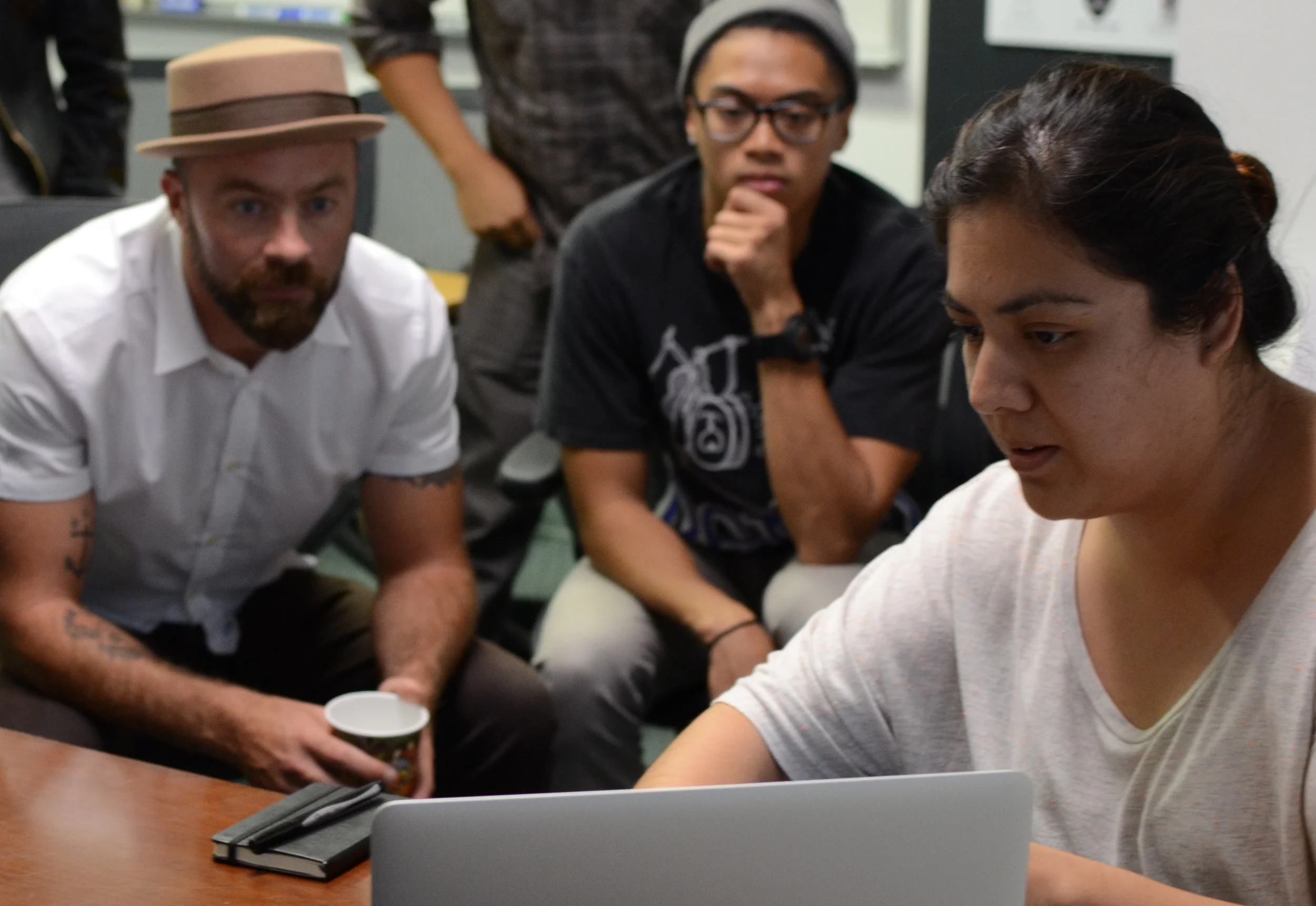 Paul (left) reviewing web design work