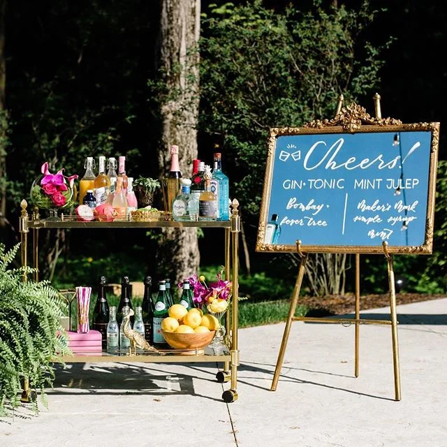 When your bar cart is perfectly in theme. 🌺🍸🍋🌈💦🍾 .
.
.
Venue: @theestatenewalbany
Photography: @styleandstory
Rentals: @lostandfoundrentals
Florals: @vesselfloralevents
Signage: @scriptonefour
Hair & MU: @thebridebar
Dresses: @shopgildedsocial
Suits: @pursuityourself
Macrons: @honeyedconfections
DJ: @joshstaleyproductions
Models : @eventshelddear, @perfectlyplanned_weddings & @yourweddingperfectlyplanned, @hearenee of @aidenandgrace/@mmjevents, @trutner & @rqhartman2 of @shopgildedsocial
.
.
.
#bridesmaids #bridesmaid #614bride #columbusohio #ohiobride #columbusbride #cbusweddings #columbusweddings #bridetribe #misstomrs #pursuepretty #shoplocal #fancydress #futuremrs #engaged #isaidyes #columbusalive #expcols #asseenincolumbus #gildedtribe #styledshoot #summerwedding #cocktails #cocktailhour #weddinginspo #barsetup #gimmeallthecolor #🌈 #rainbowflowers #barcart