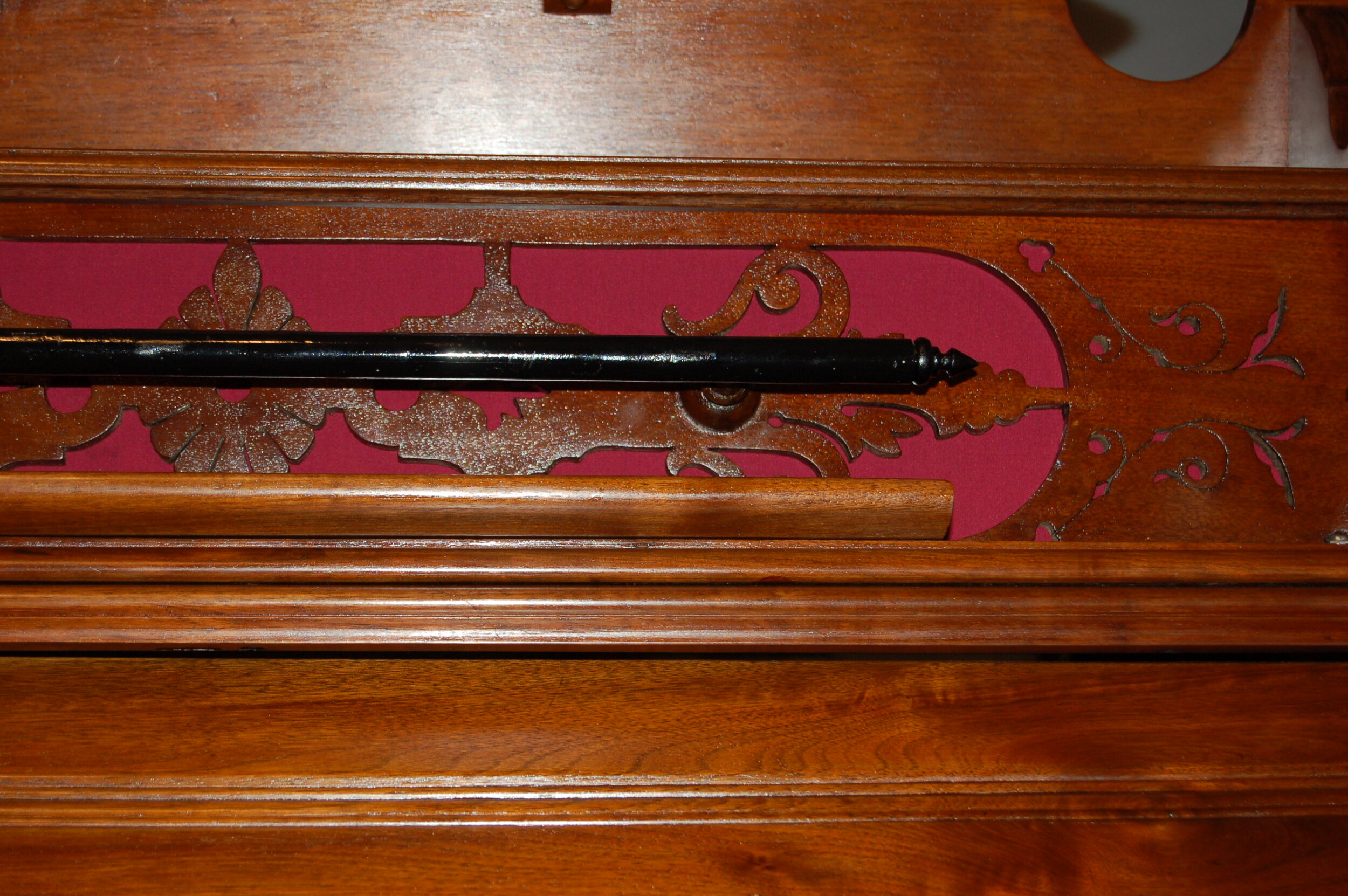  The black bar of the music desk was worm treated, holes filled and painted 
