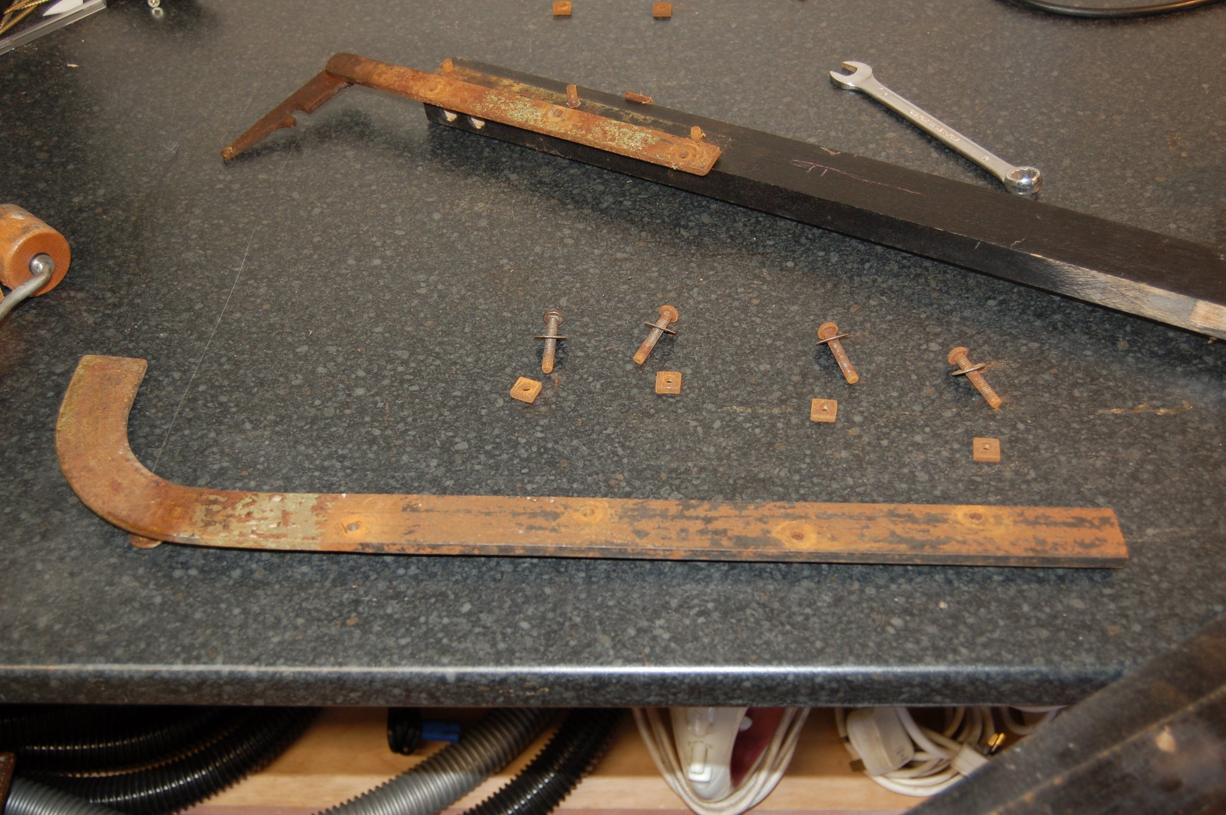 Part of the hand pump mechanism stripped for painting