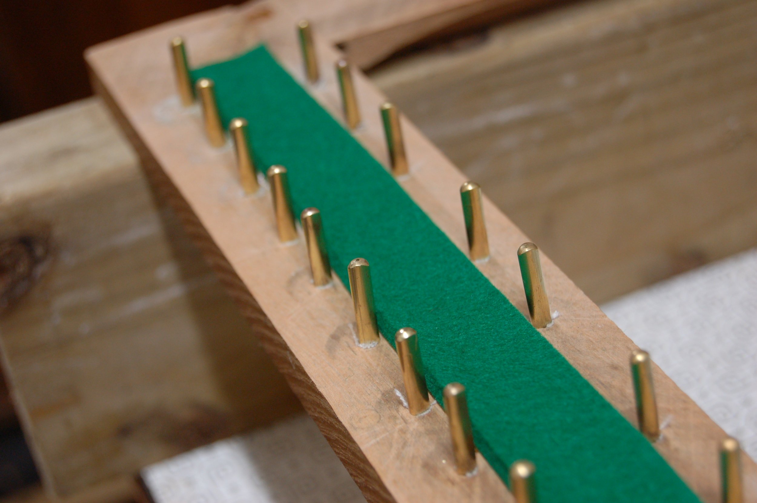 Full set of new brass front key-guide pins in place