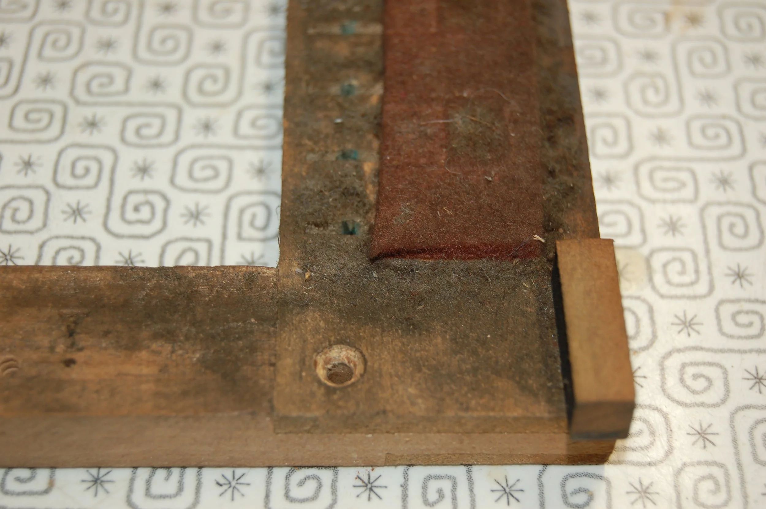  The frame is cleaned and the original felt will be retained since it is intact 