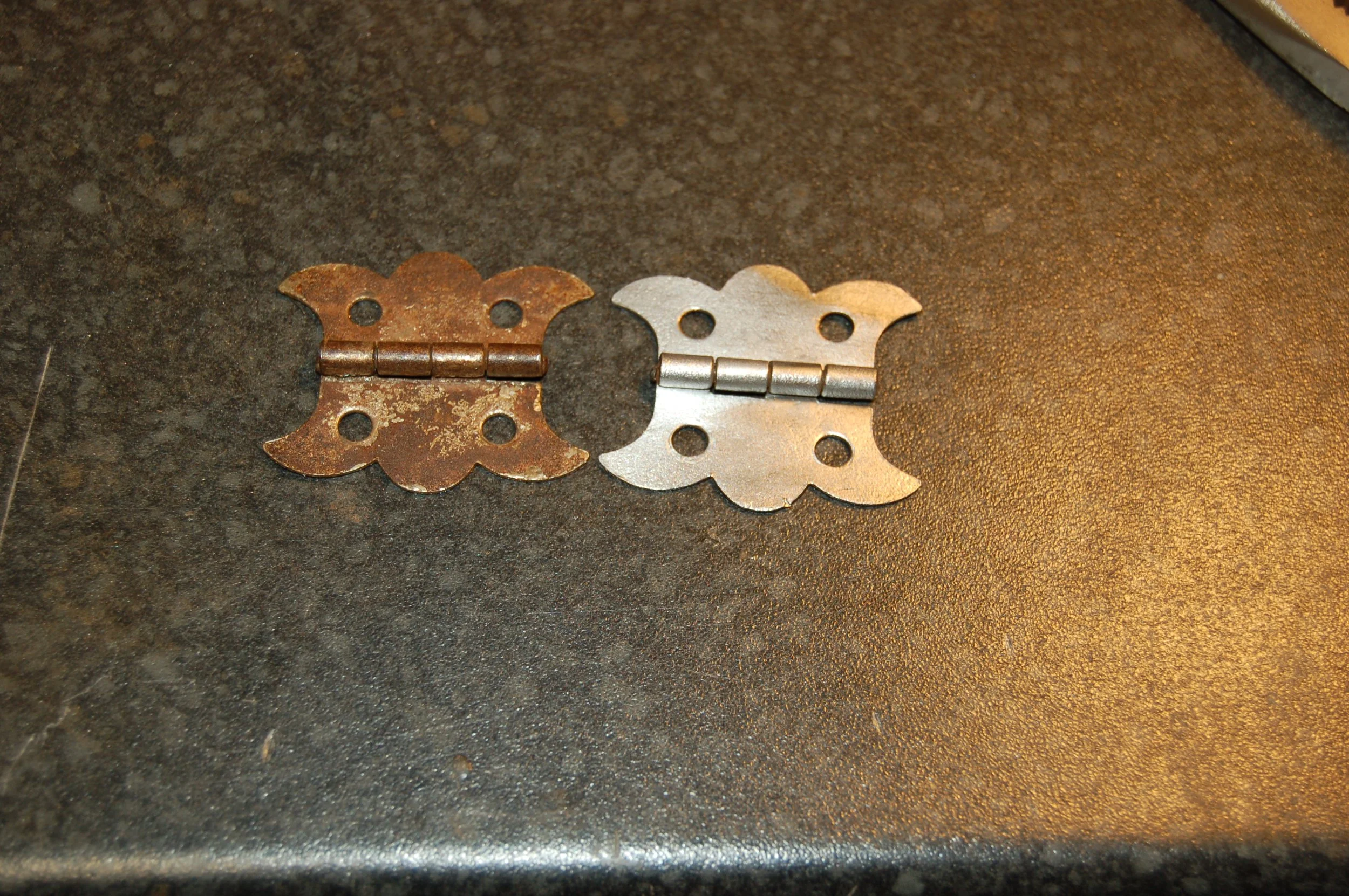  Rusty hinges being cleaned 