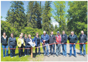 From L to R: Carol Simpson (Coun- cillor, Town of Blackfalds); Melody Stol (Mayor, Blackfalds); Betty Anne Graves (TCT board member); Dana Kreil (Councillor, Lacombe County); Paula Law (Deputy Reeve, Lacombe County); Linda Strong-Watson (executive director, Alberta TrailNet); Debbie Olsen (president, Central Alberta Regional Trails Society); Ken Wigmore (Reeve, Lacombe County); Rod Fox (MLA); Cliff Soper (Councillor, Lacombe County); Blaine Calkins (MP); Kelly Turkington (acting director of operations, Lacombe Research Centre); Reuben Konnick (Councillor, City of Lacombe). 