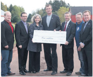 From L to R: Charlie McGeoghegan (MLA, Belfast-Murray Harbour), Robert Vessey (Ministry of Transportation and Infrastructure Renewal), Deborah Apps (president & CEO, TCT), Alan McIsaac (Ministry of Education and Early Childhood Development), Robert Henderson (Ministry of Tour ism and Culture), Bryson Guptill (president, Island Trails), David Dunphy (Mayor, Stratford, PEI). 