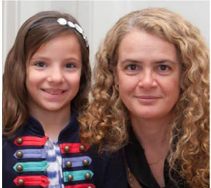 TCT National Champion Julie Payette shares a moment with young Janelle. PHOTO: LAURA BERMAN 
