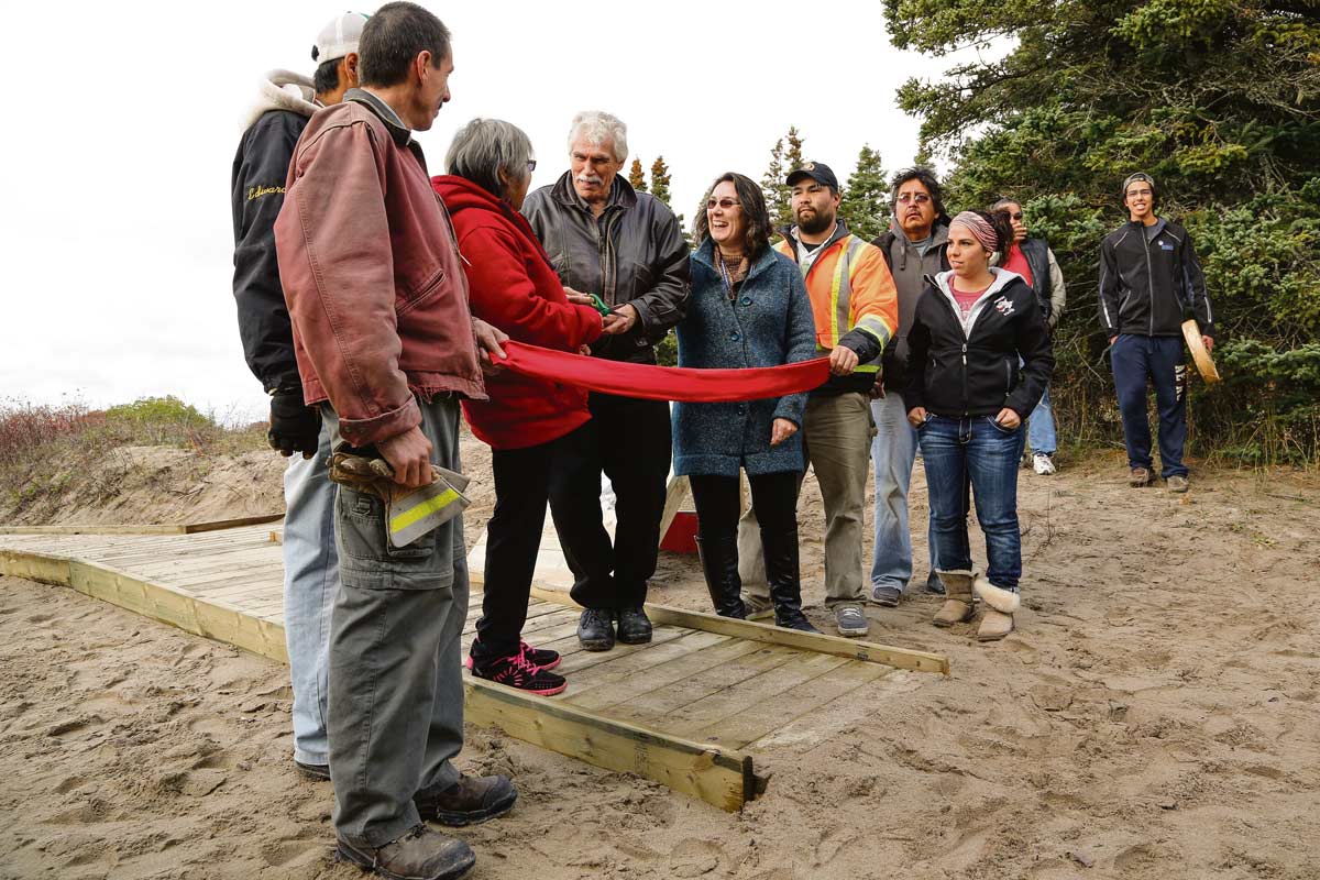 Chief Michano with trail builders and Elders celebrating the Kwewiskaning Trail ribbon cutting ceremony at Biigtigong Nishnaabeg First Nation ©GARY McGUFFIN