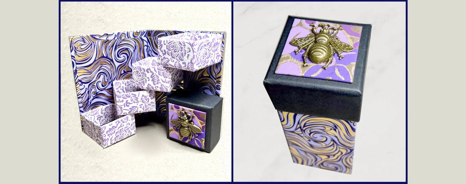 Stair step box in shades of purple with a big brass bee
