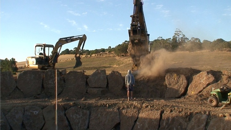 Hot and dusty! The first years work on the henge in progress.