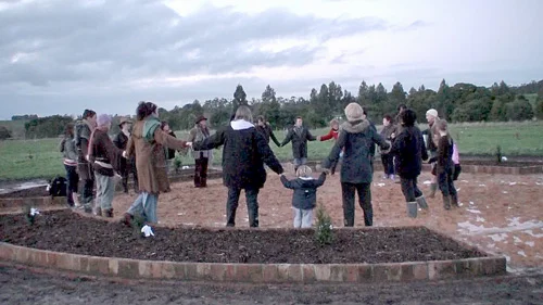 A circle of mothers and their children