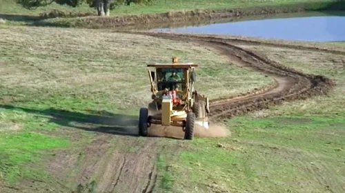 The grader at work making one of the Side walks
