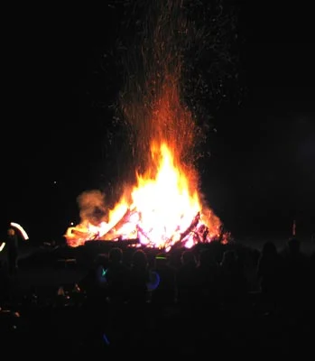 After the bonfire is lit (note size of fire twirler on lower left corner)