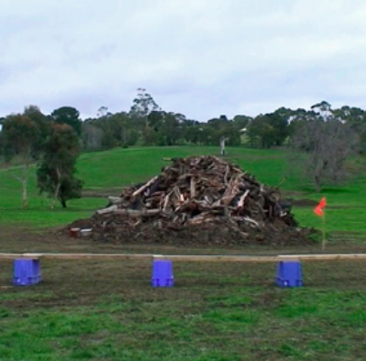 Before the bonfire is lit, tubs and planks of wood are set around the edge for seating.