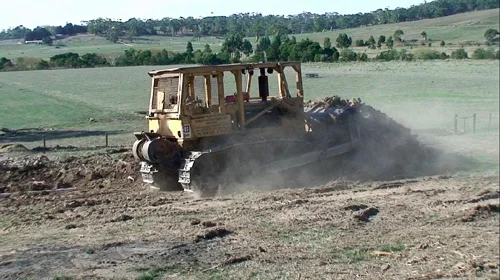 Levelling the ground near the old outbuildings
