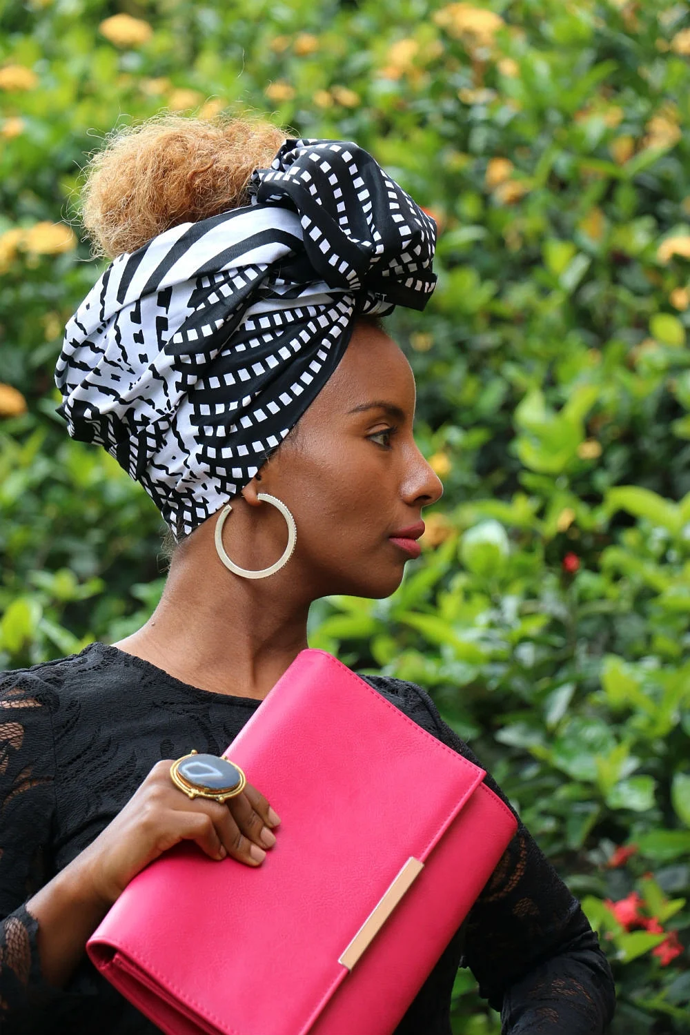We chose a bright pink leather clutch, silver hoops and a semi-precious stone ring as accessories to compliment headwrap GUGU.