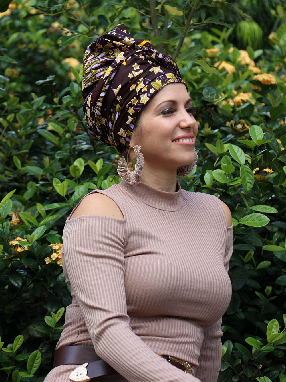 Daniela chose these stunning tassel earrings and a brown leather belt to compliment her outfit. Soft orange matte lipstick from cosmetic brand AUSTRALIS , completed the overall look.