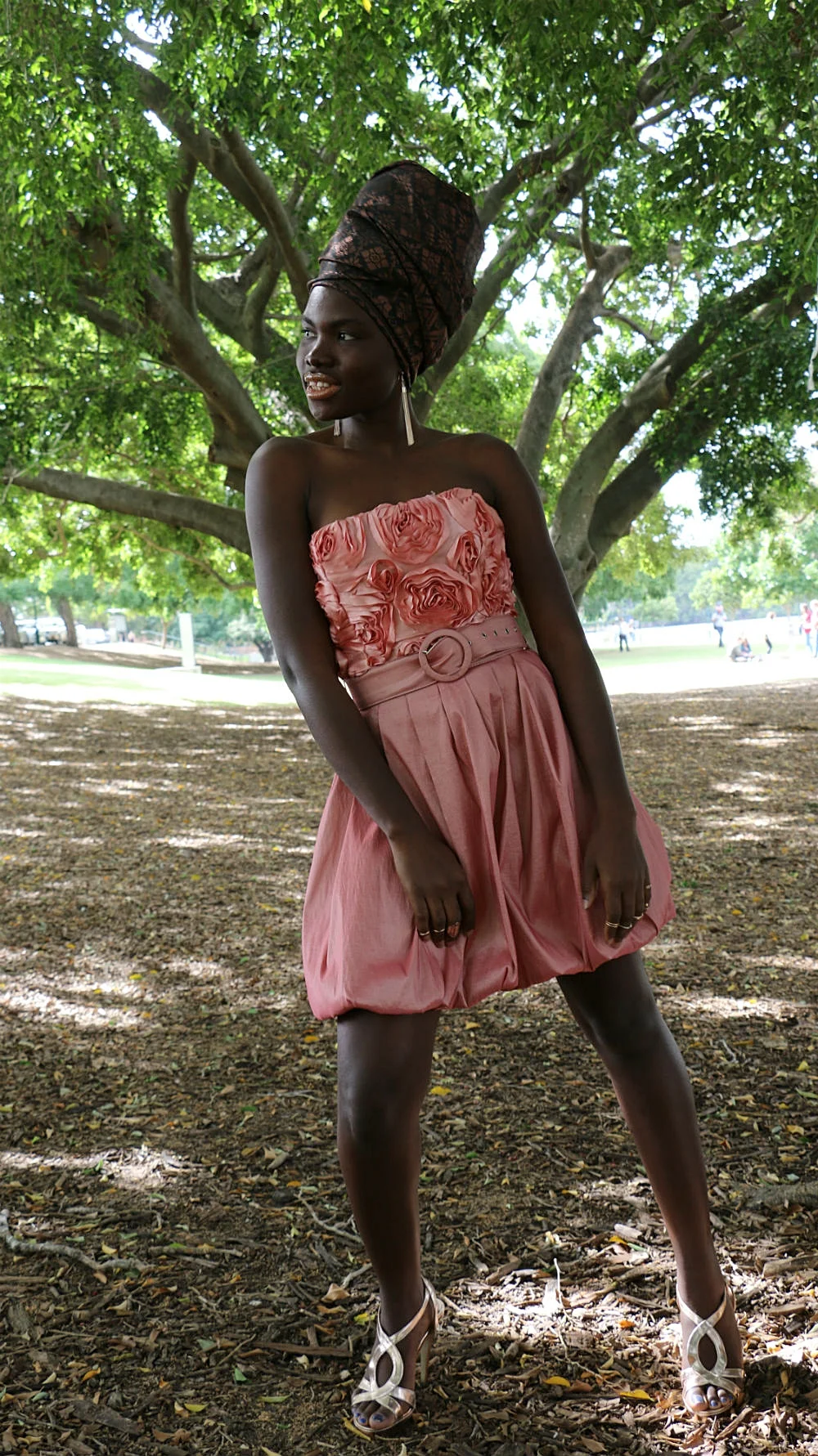 MARIAMA T's deep peach coloured belted mini dress complete with rose applique work across the bodice was the ideal choice for headwrap ROSE GOLD - strappy high heels in rose gold complete this divine look.